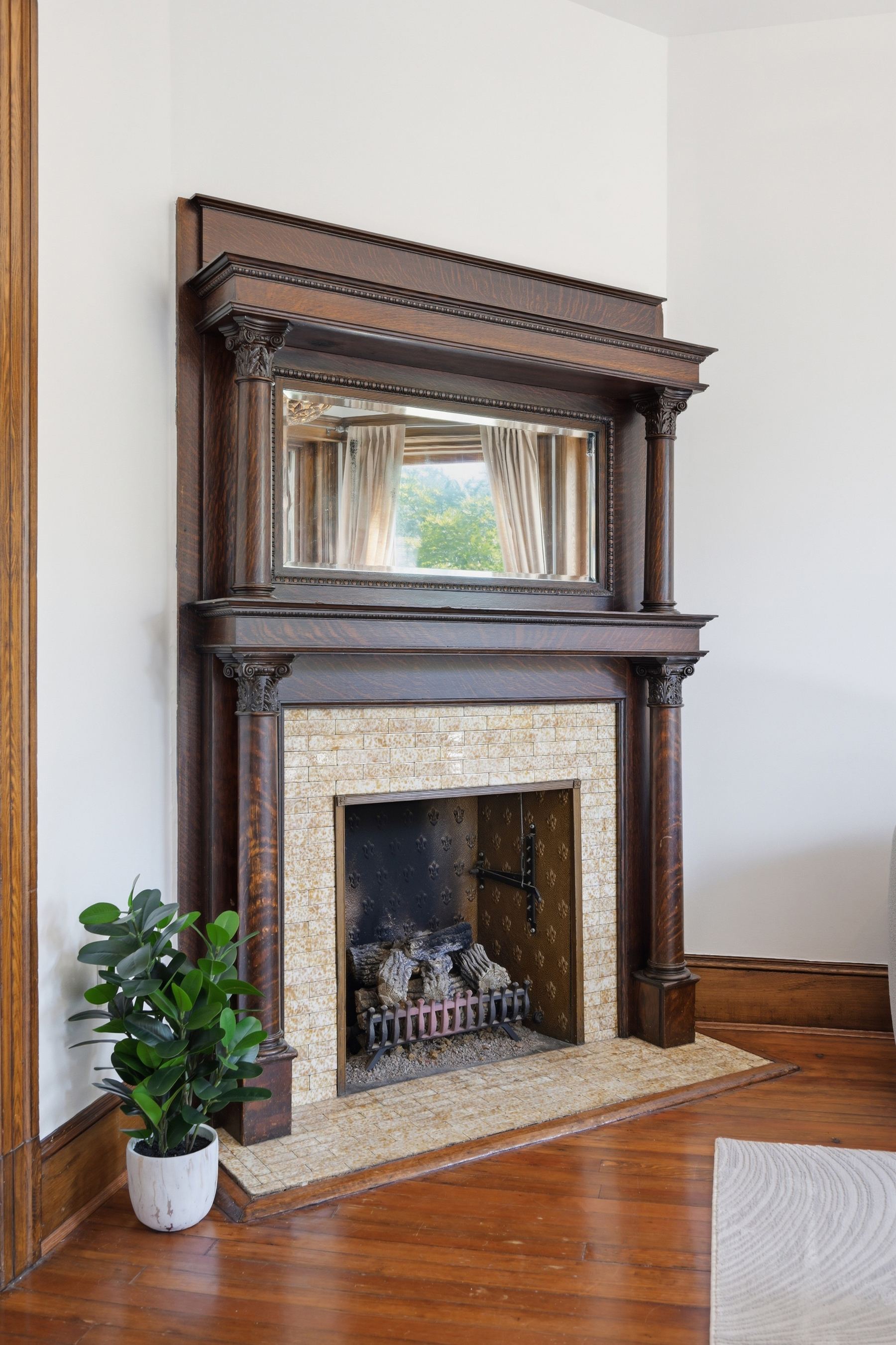Living room fireplace with original Corinthian columns