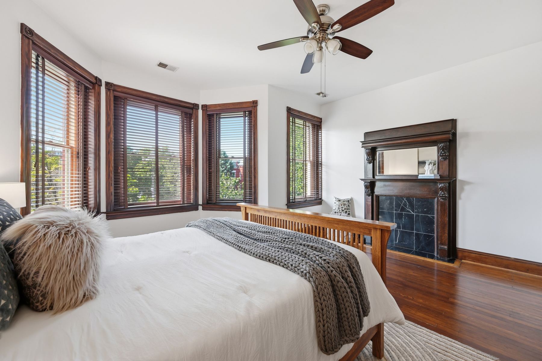 Primary bedroom with original fireplace